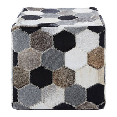 Hexagonal patterned ottoman with a mix of colors on a white background