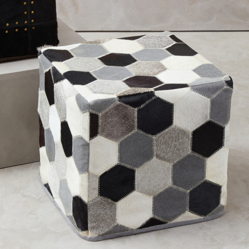 Hexagonal patterned ottoman on a neutral background