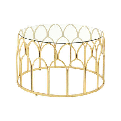 Gold metal coffee table with glass top on a white background