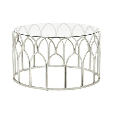 Decorative round table with metal frame and glass top on a white background