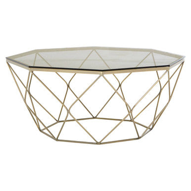 Hexagonal coffee table with gold metal frame and glass top on a white background