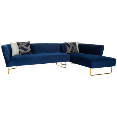 Blue sectional sofa with gold legs on a white background