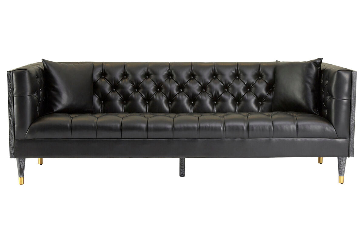 Black leather sofa with tufted backrest on a white background