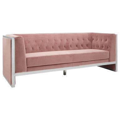 Pink tufted sofa with metal frame on a white background