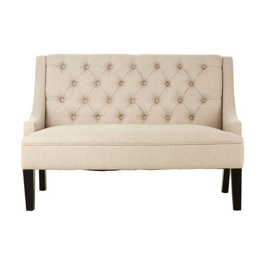 Beige tufted loveseat on a white background