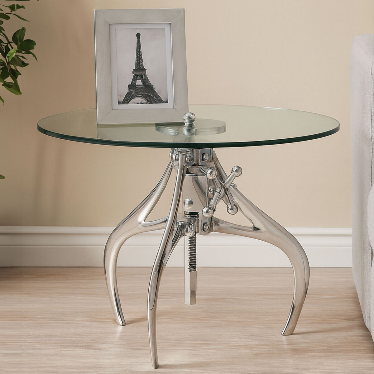 Glass table with metal base in a room setting