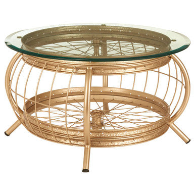 Gold wireframe coffee table with glass top on a white background