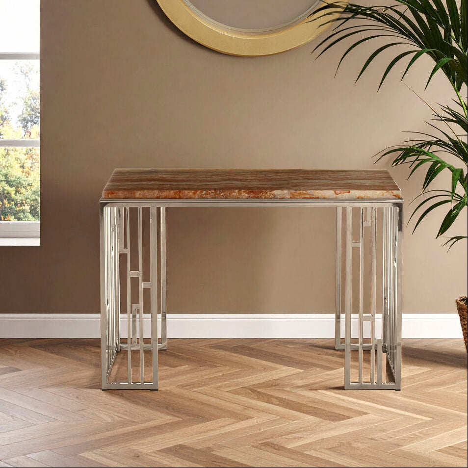 Console table with wooden top and metal frame in a room with a window and plant.