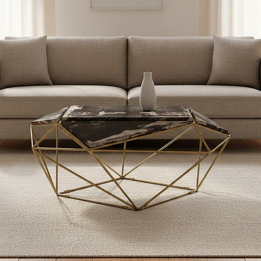 Beige sofa in a living room with a geometric coffee table and abstract art on the wall.