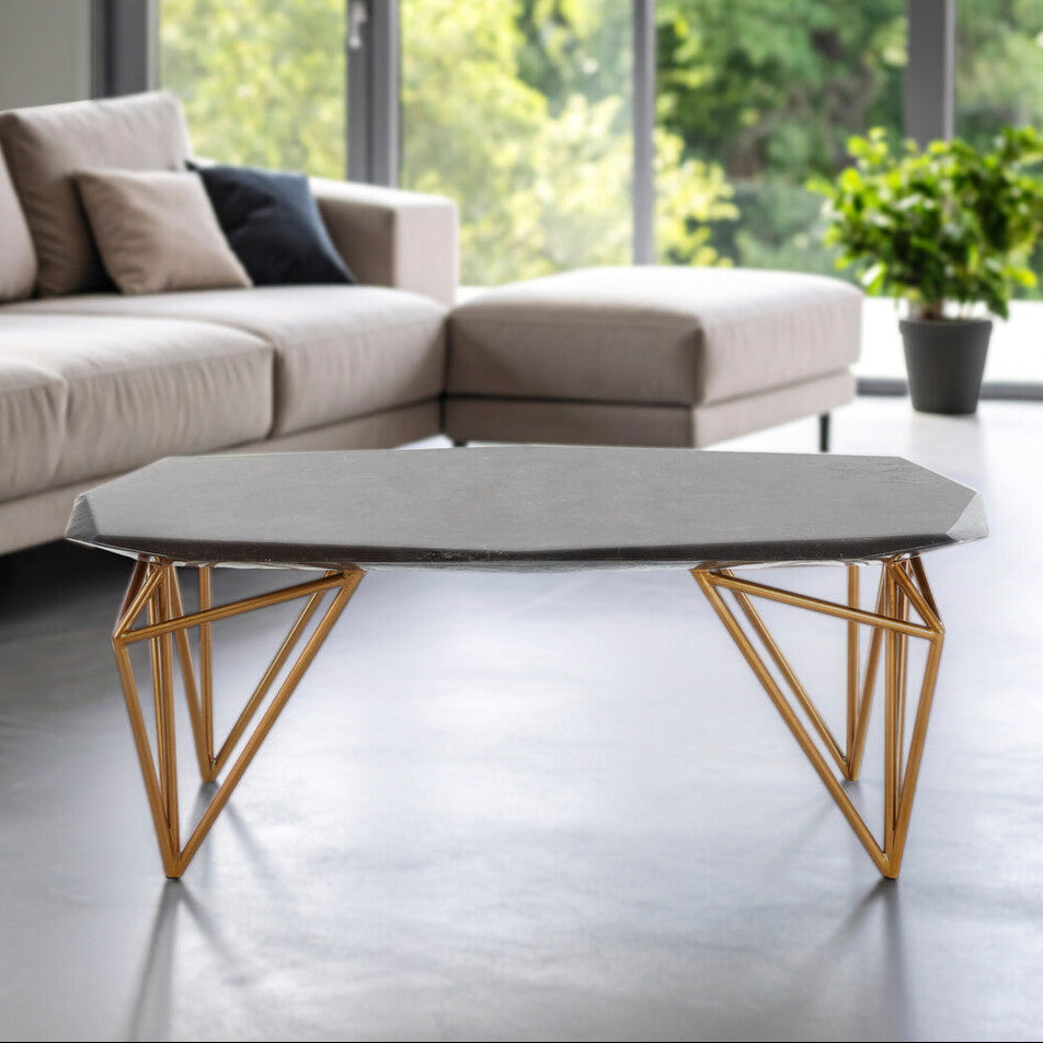 Modern living room with a sectional sofa and geometric coffee table.