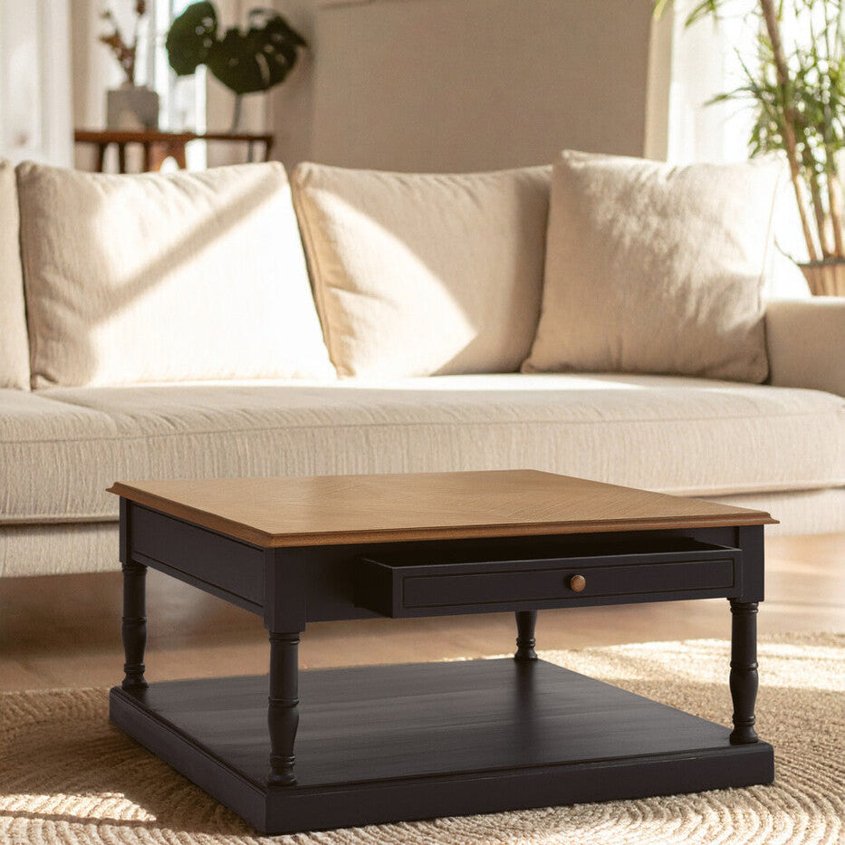 Wooden coffee table in front of a beige sofa with a neutral background