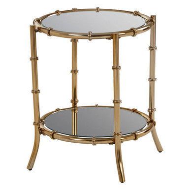 Gold-framed round side table with two glass shelves on a white background