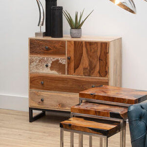 Modern living room with wooden furniture, blue sofa, and decorative elements.