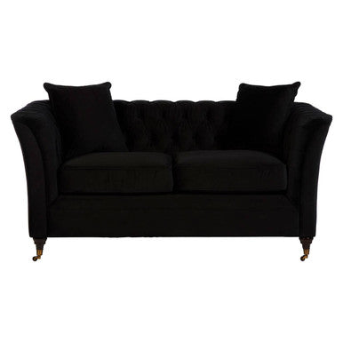 Black sofa with two cushions on a white background