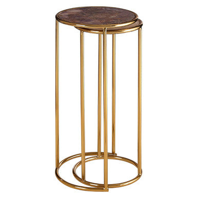 Gold side table with a round marble top on a white background