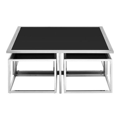 Set of two nesting tables with black glass tops and chrome metal frames on a white background