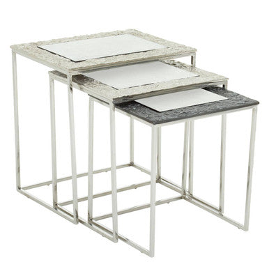 Set of three nesting tables with marble-like tops and metal frames on a white background
