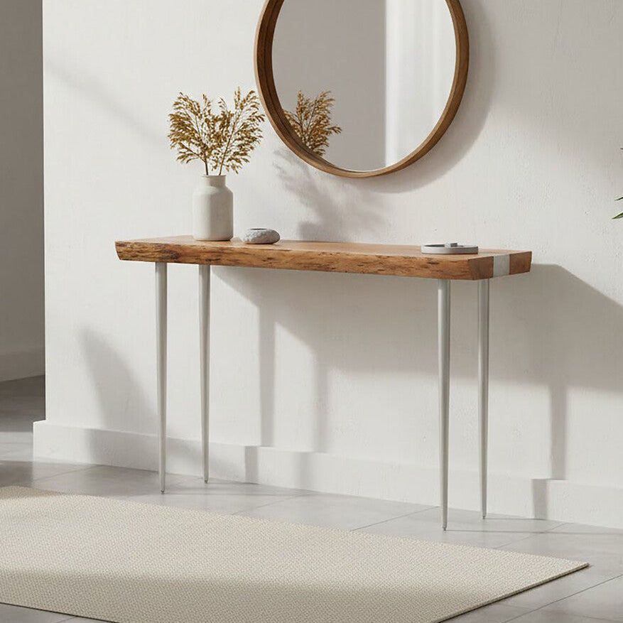 Modern interior with a wooden console table, round mirror, and decorative elements.