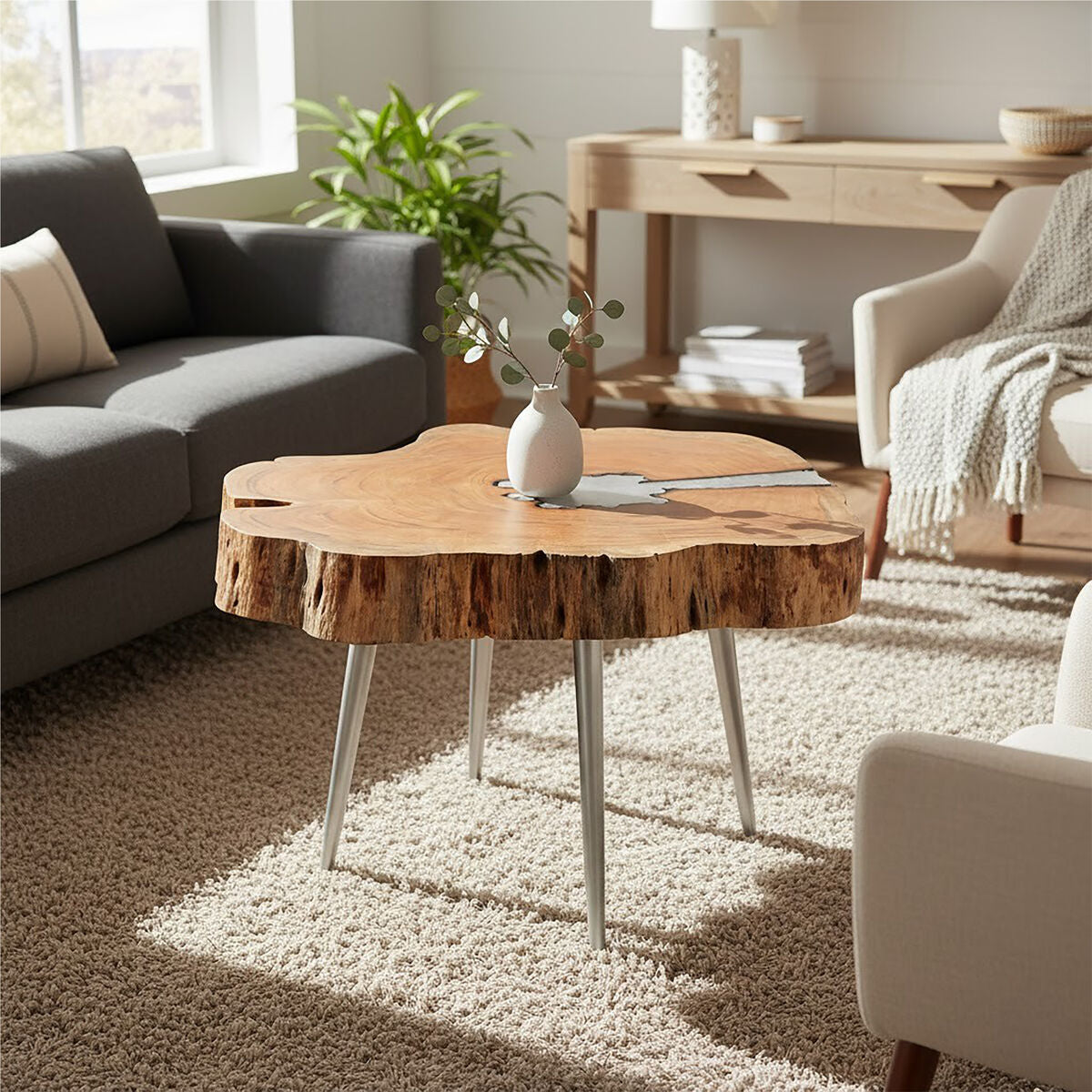Wooden coffee table in a living room with a vase and books on top