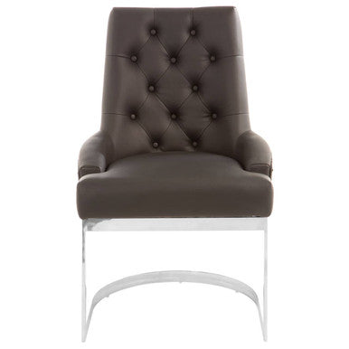 Brown tufted chair with white legs on a white background