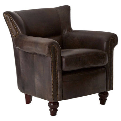 Brown leather armchair with nailhead trim on a white background