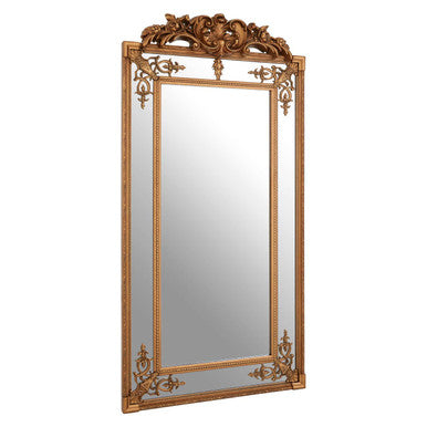 Decorative gold-framed mirror on a white background