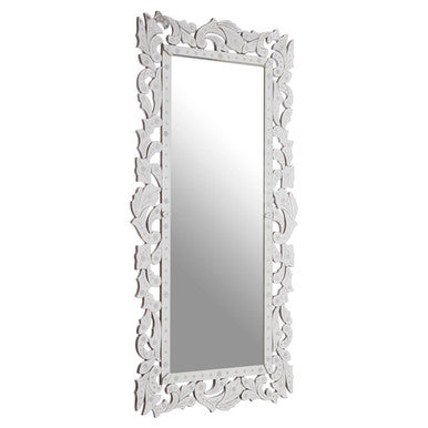 Decorative white mirror with intricate patterns on a white background