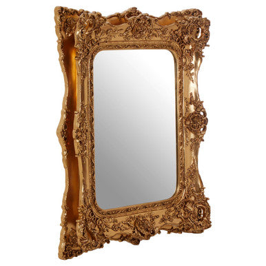Decorative gold-framed mirror on a white background