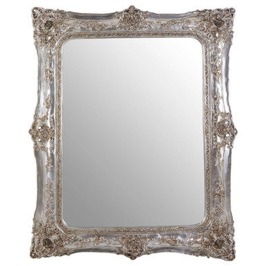 Decorative silver mirror with intricate detailing on a white background