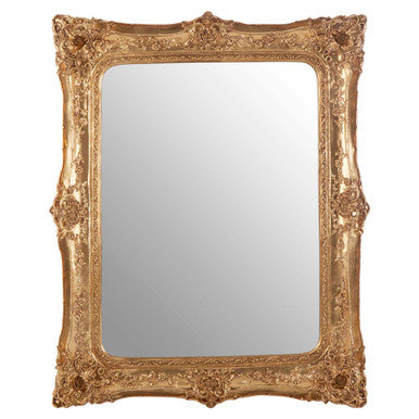 Decorative gold-framed mirror on a white background