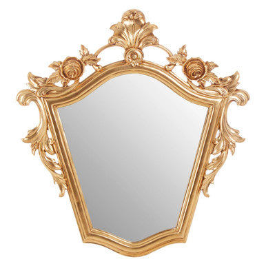 Decorative gold mirror with intricate designs on a white background