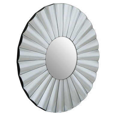 Round mirror with a sunburst design on a white background