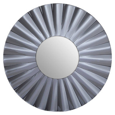 Round mirror with a sunburst pattern on a white background
