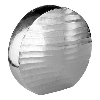 Round metallic object with reflective surface on a white background