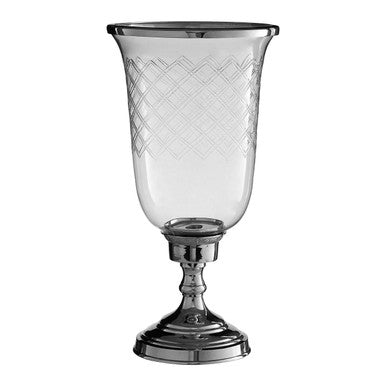 Decorative glass candle holder with etched design on a white background