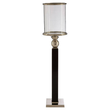 Decorative floor lamp with a black base and clear glass shade on a white background