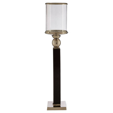 Decorative floor lamp with a black base and glass shade on a white background