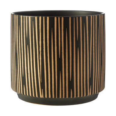 Black pot with gold vertical stripes on a white background