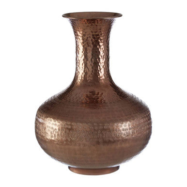 Copper vase with a textured surface on a white background