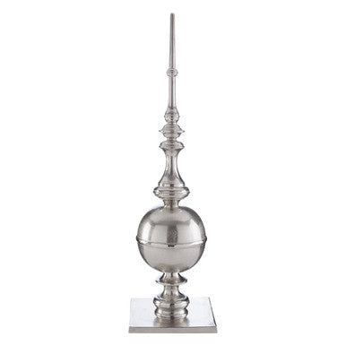 Decorative silver finial on a white background