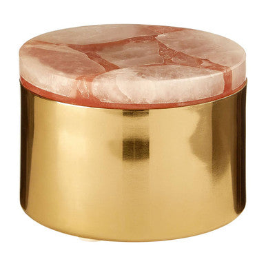 Round marble table with a gold base on a white background