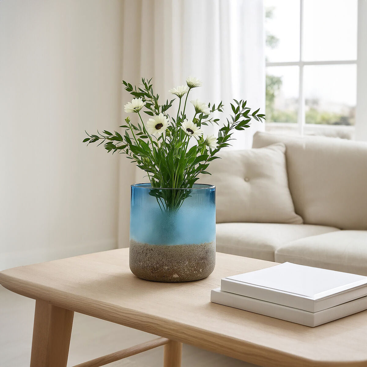 Glass vase with flowers on a wooden table in a living room setting