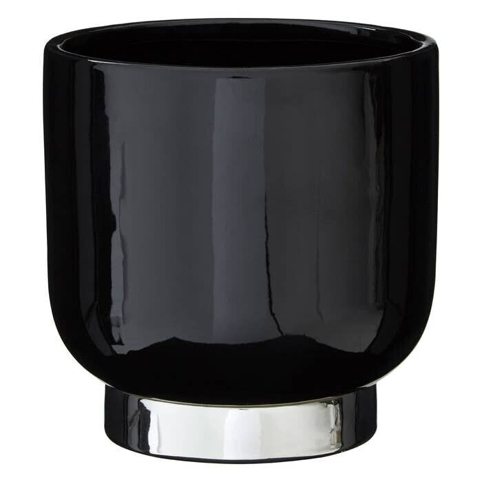 Black glass vase with silver base on a white background