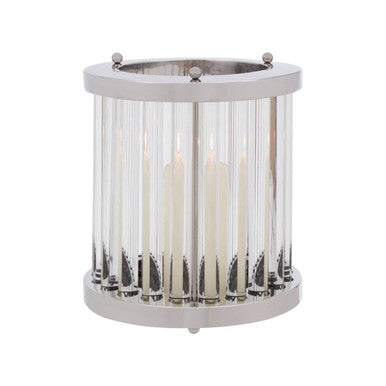Decorative candle holder with glass and metal design on a white background
