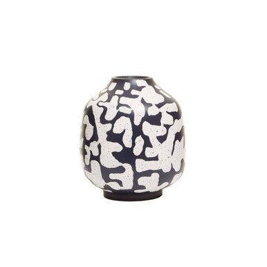Decorative vase with black and white abstract pattern on a white background