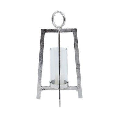 Decorative candle holder with a metallic frame on a white background