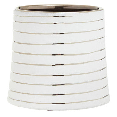 White cylindrical vase with ribbed texture on a white background