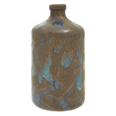 Ceramic bottle with blue glaze on a white background