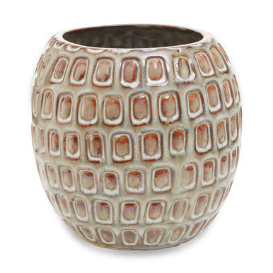 Ceramic vase with a textured pattern on a white background