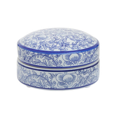 Blue and white decorative box with intricate patterns on a white background